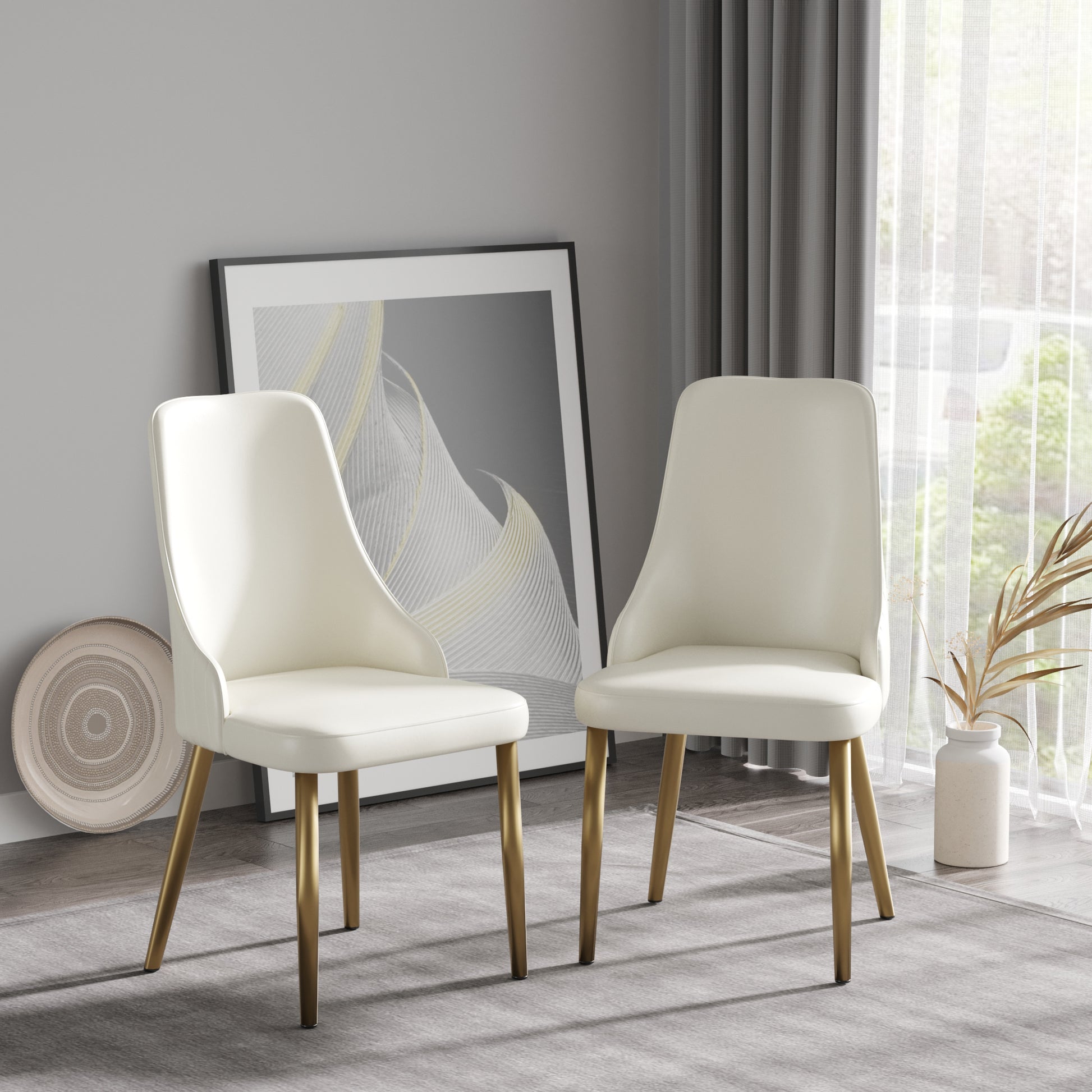 Two cream upholstered dining chairs with gold metal legs elegant modern design