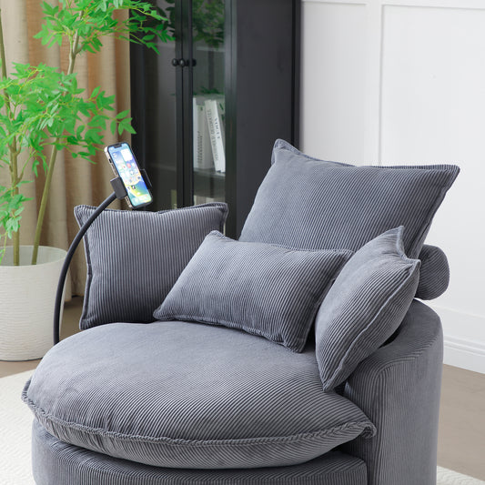 Plush grey corduroy accent chair with plush pillows perfect for a cozy reading nook