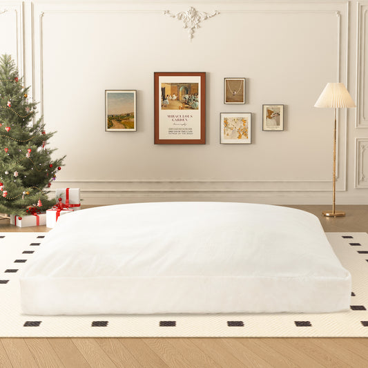 Plush white oversized floor cushion for relaxed seating and lounging