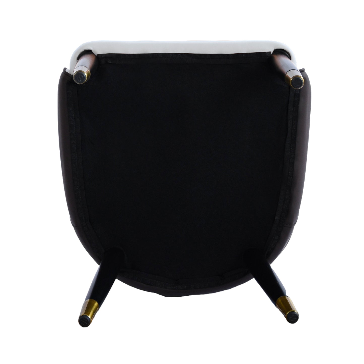Underside view of a white tufted dining chair with black fabric wooden legs and gold caps