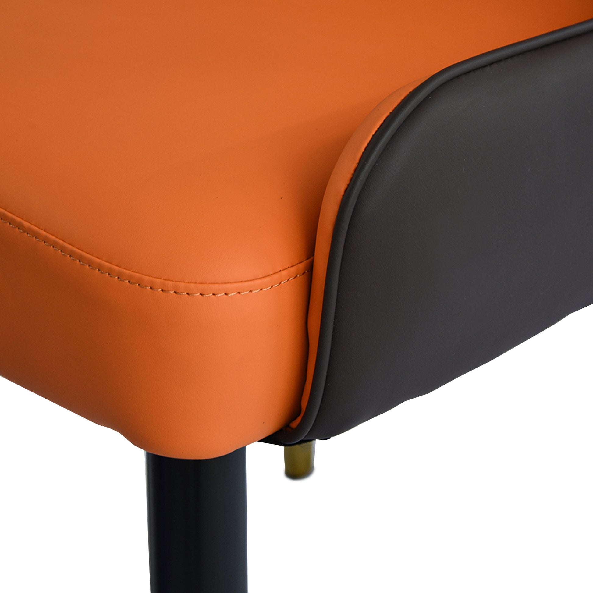 Orange and black faux leather accent chair seat detail