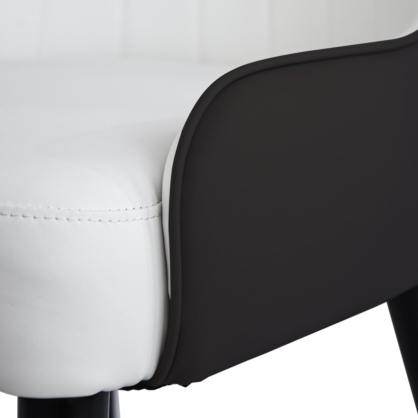 Closeup of a white faux leather bar stool seat with black accents and stitching