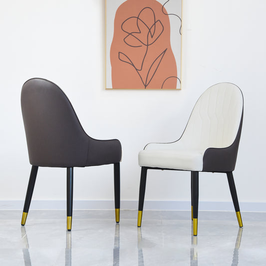Modern dining chair with dark gray upholstery and goldtipped black legs