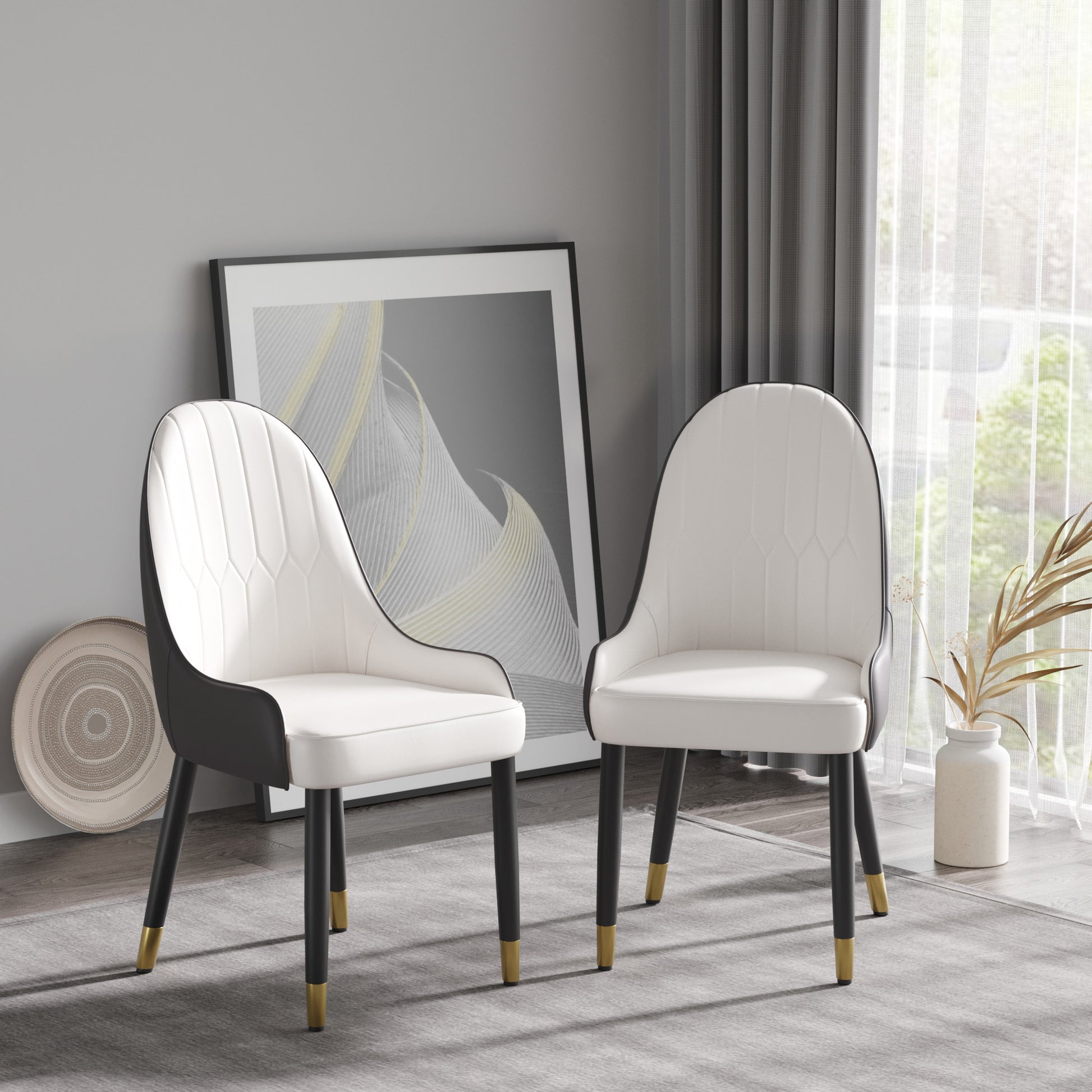 Elegant white upholstered dining chair with black accents and goldtipped legs