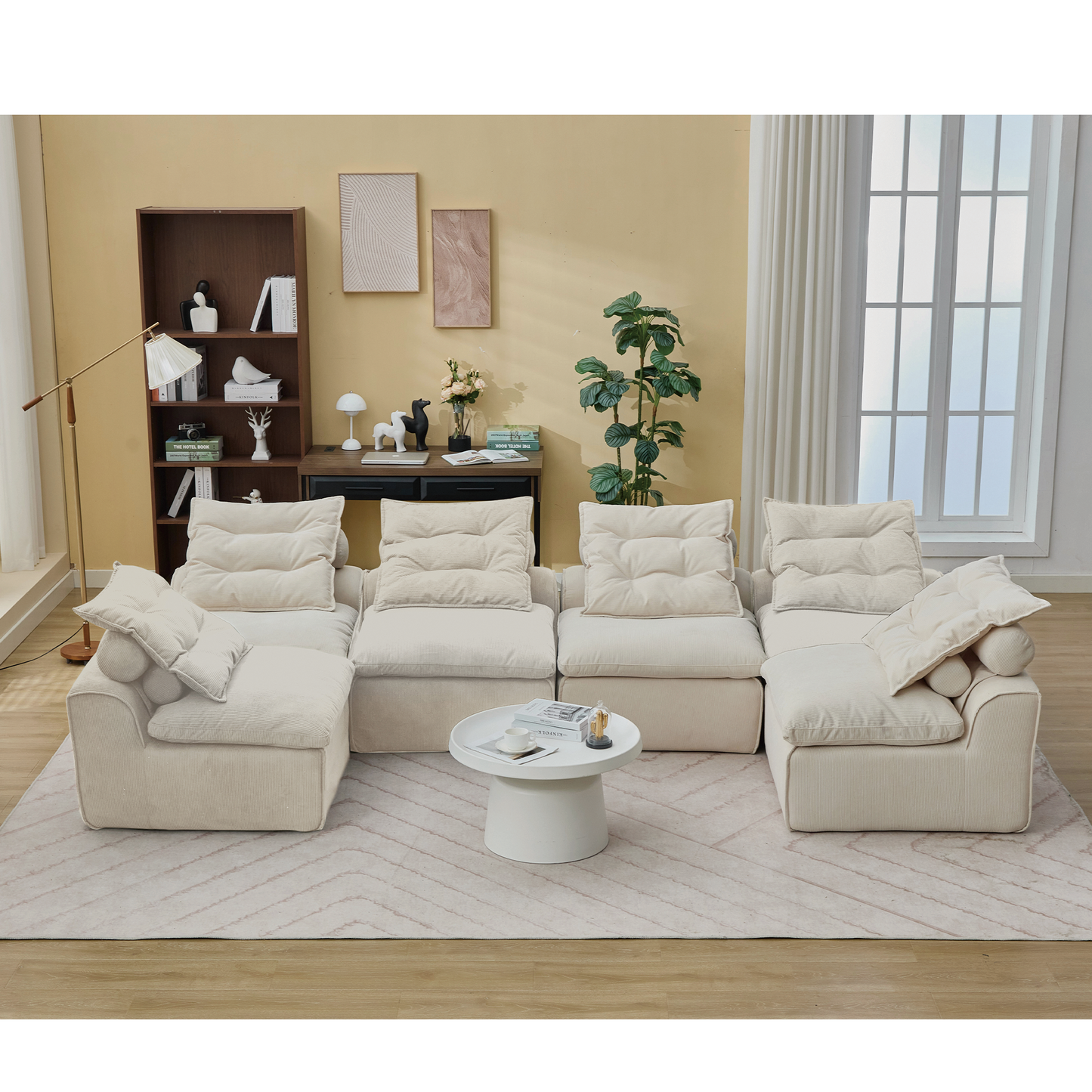 Plush cream corduroy sectional sofa with plush tufted cushions and round bolster pillows