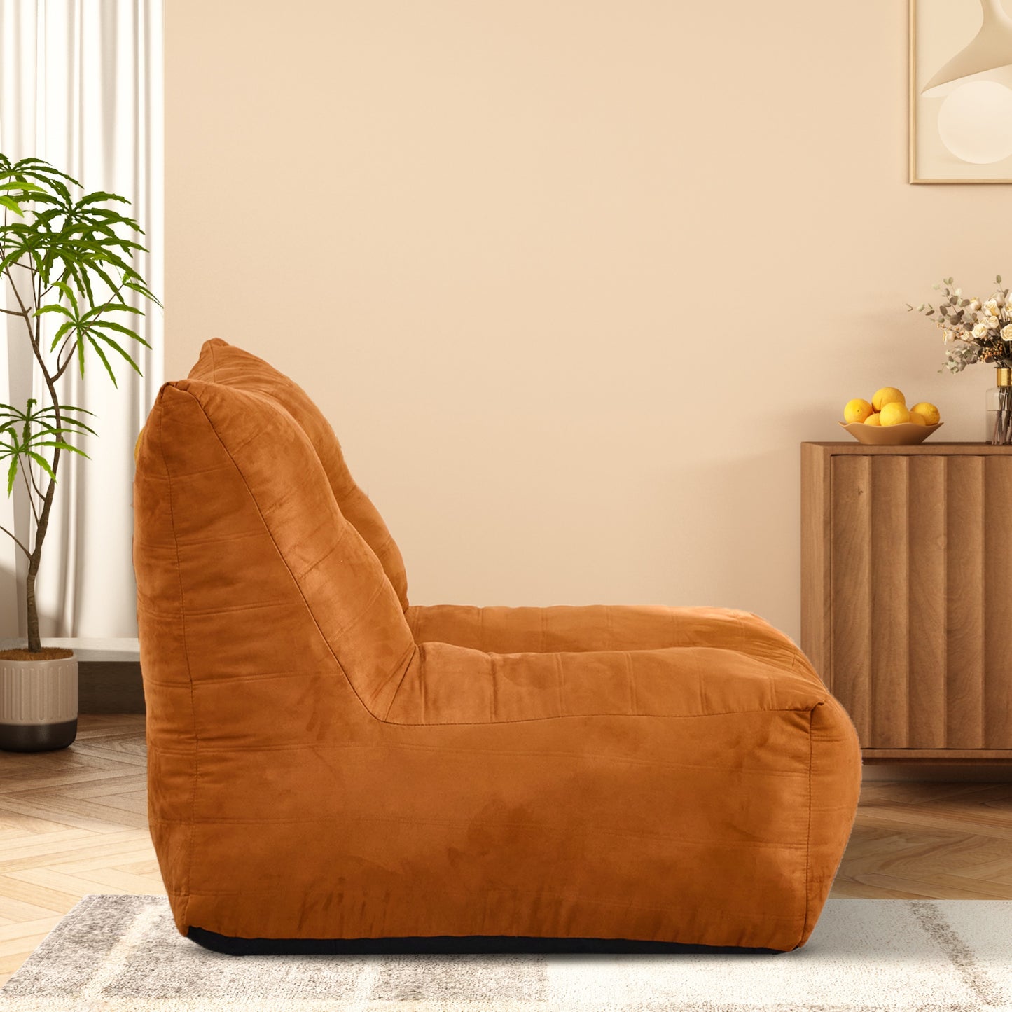 Comfortable orange suede bean bag chair with plush cushioning for living room relaxation