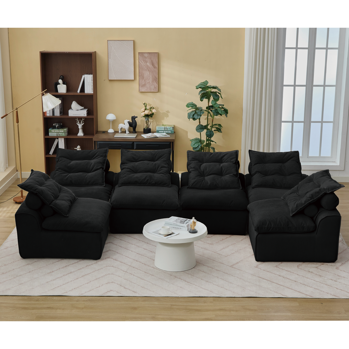Black corduroy sectional sofa with plush deep seating and a low profile design