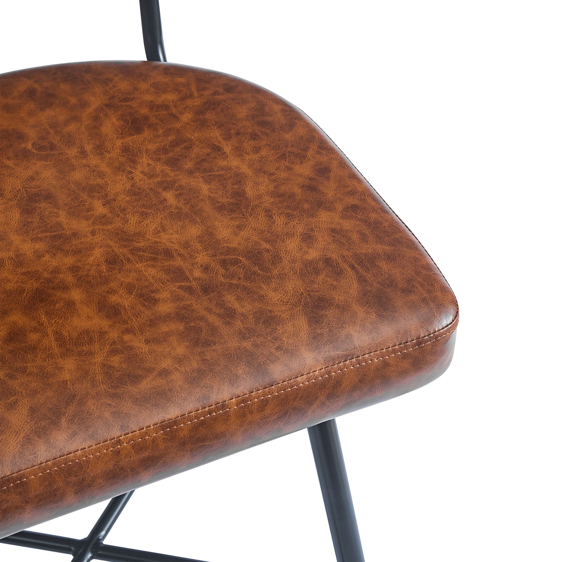 Tan faux leather padded seat with visible stitching detail on metal chair