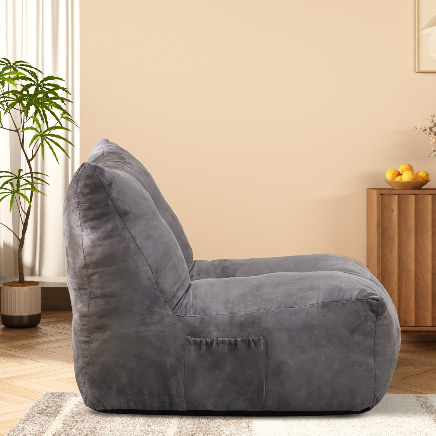 Dark gray plush bean bag chair with side pocket and comfortable support