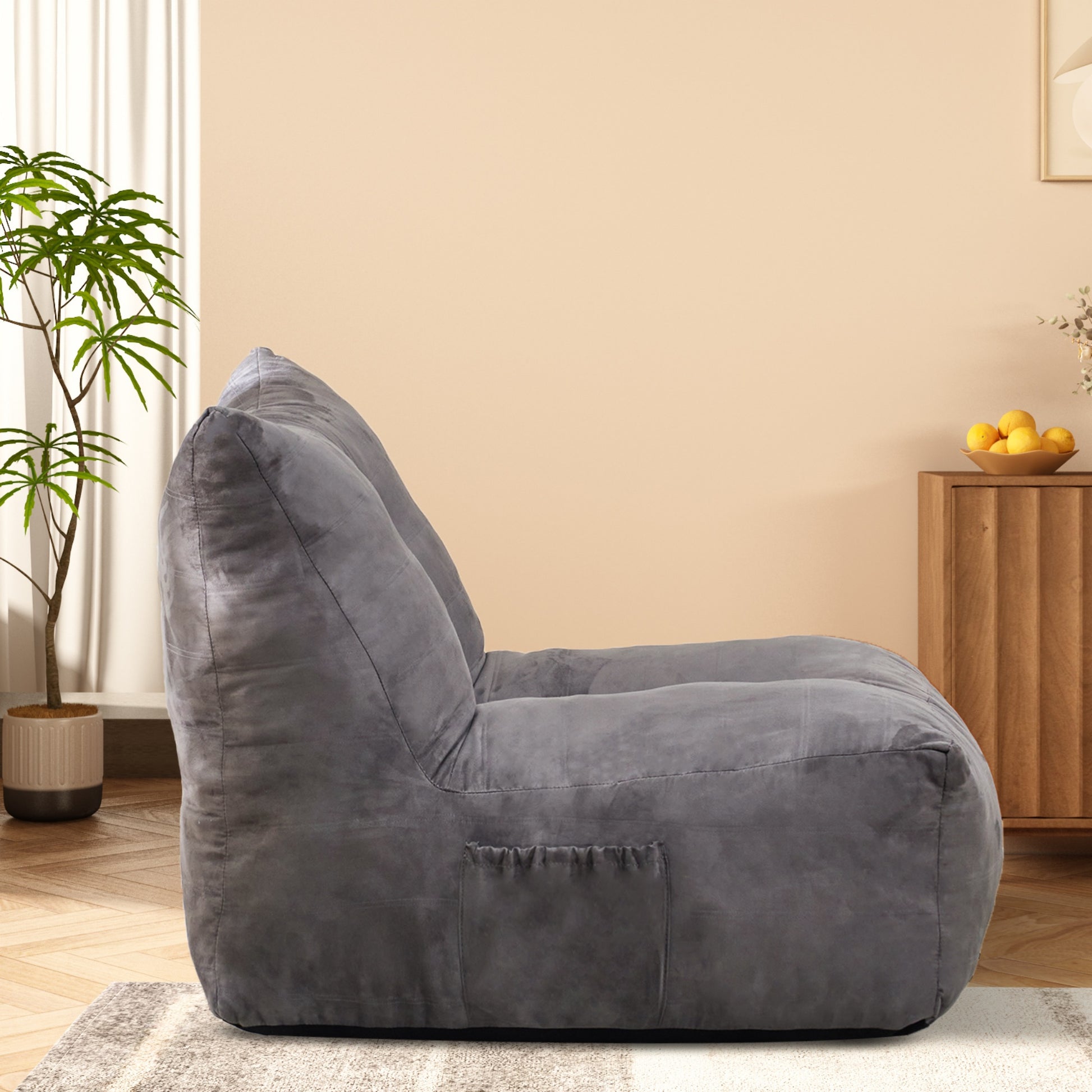 Dark gray plush bean bag chair with side pocket and comfortable support