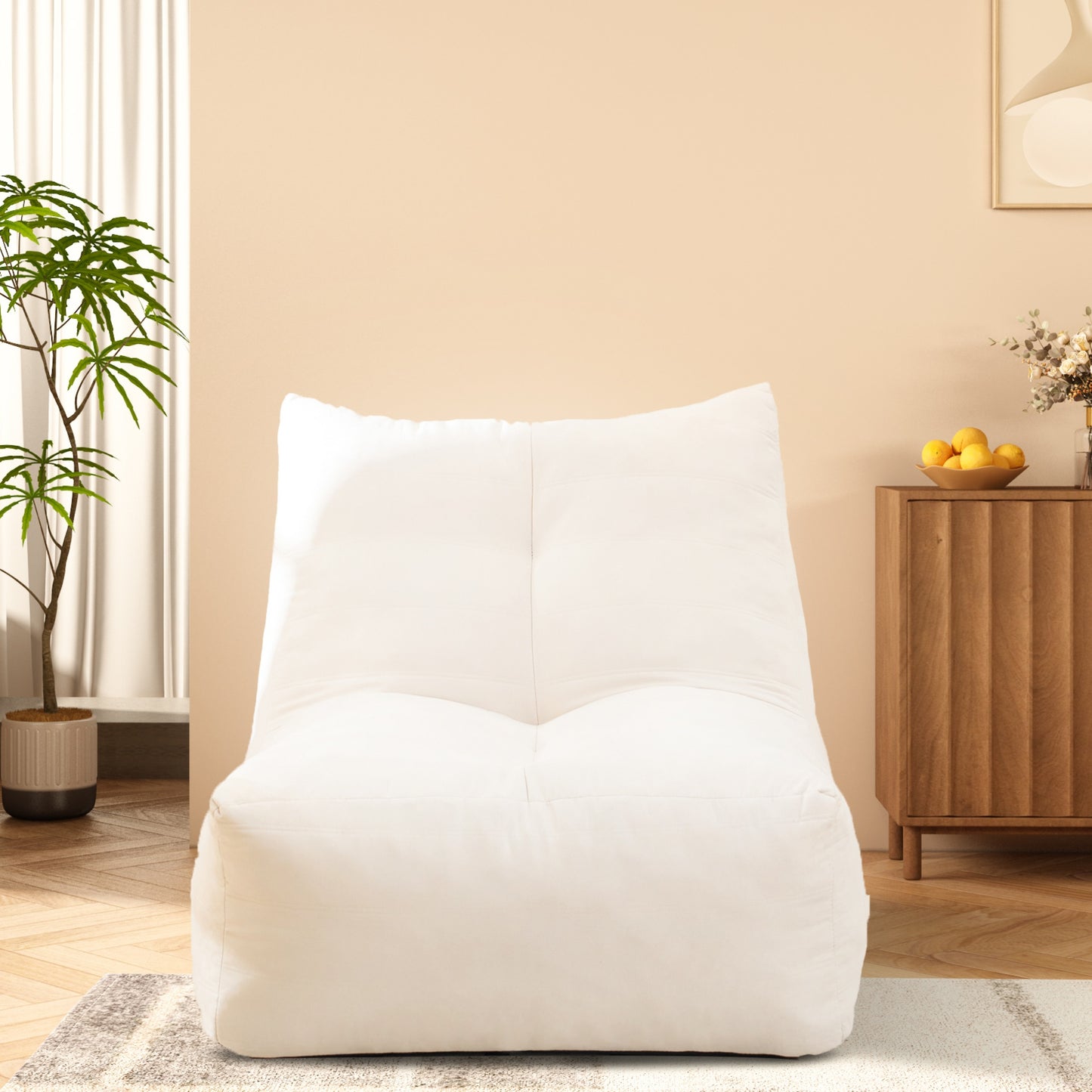 Large plush white bean bag chair with tufted accents perfect for lounging