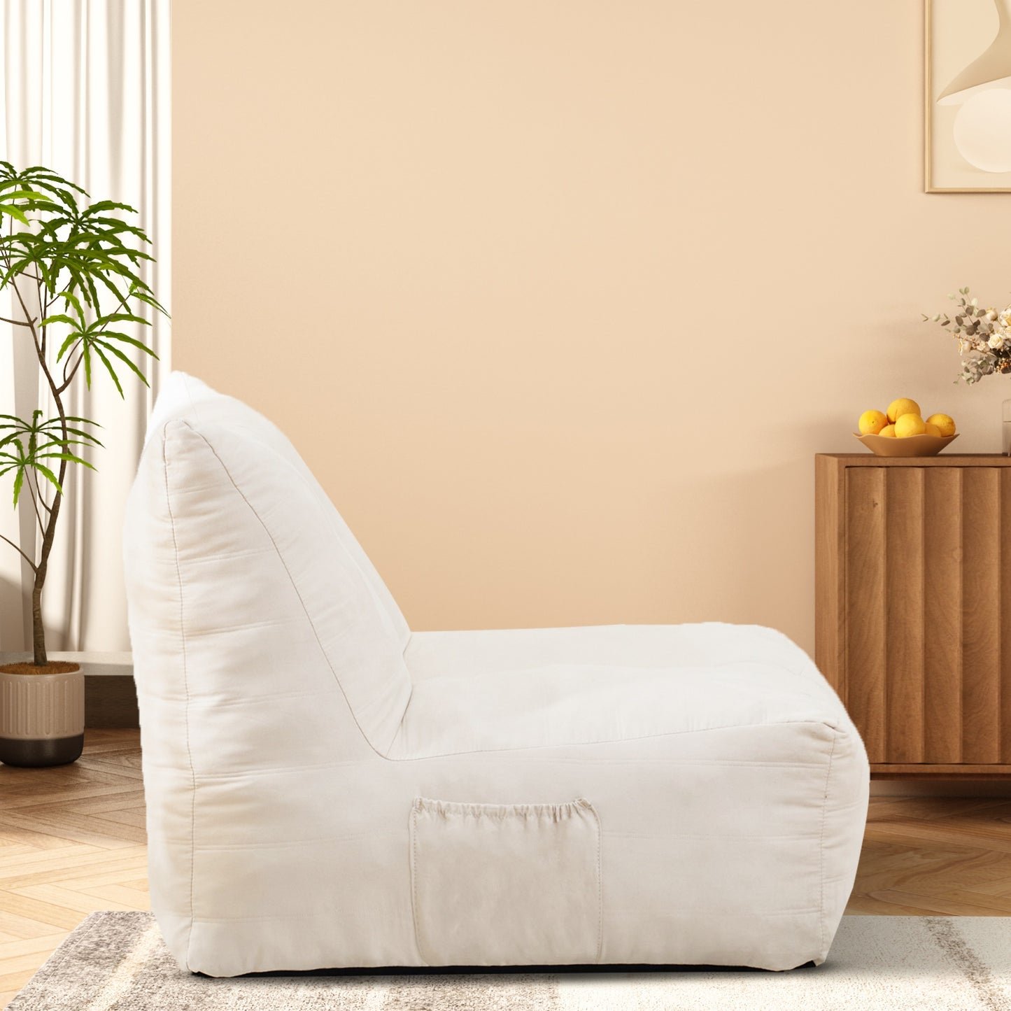 Comfortable cream bean bag chair with side pocket perfect for lounging