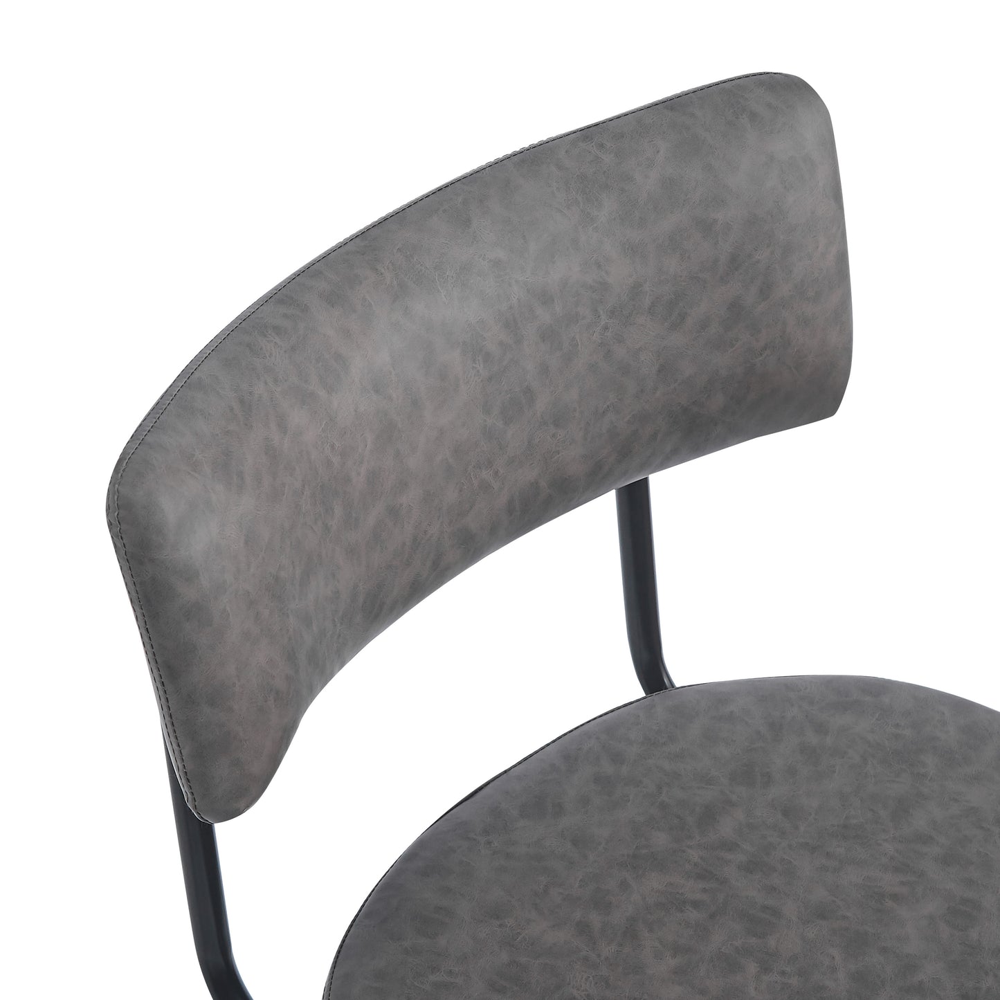 Close up of a grey faux leather dining chair seat and backrest