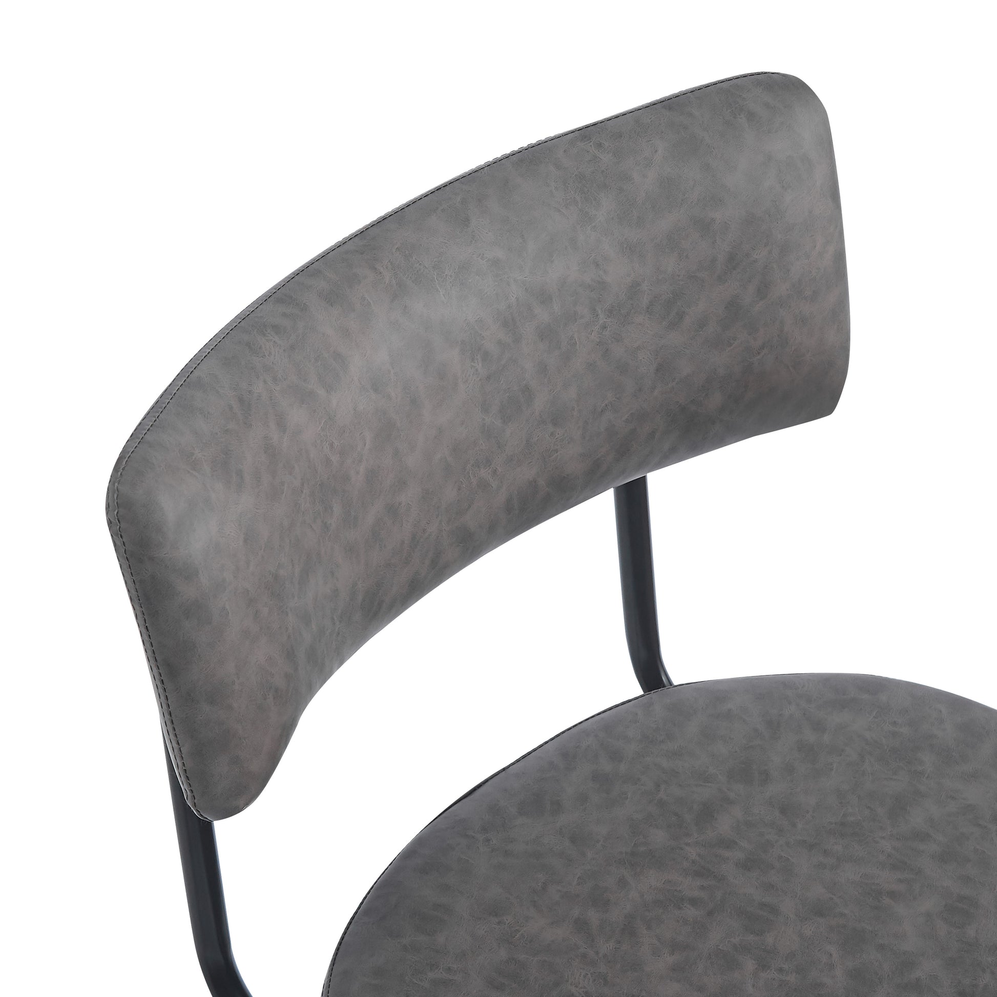 Close up of a grey faux leather dining chair seat and backrest