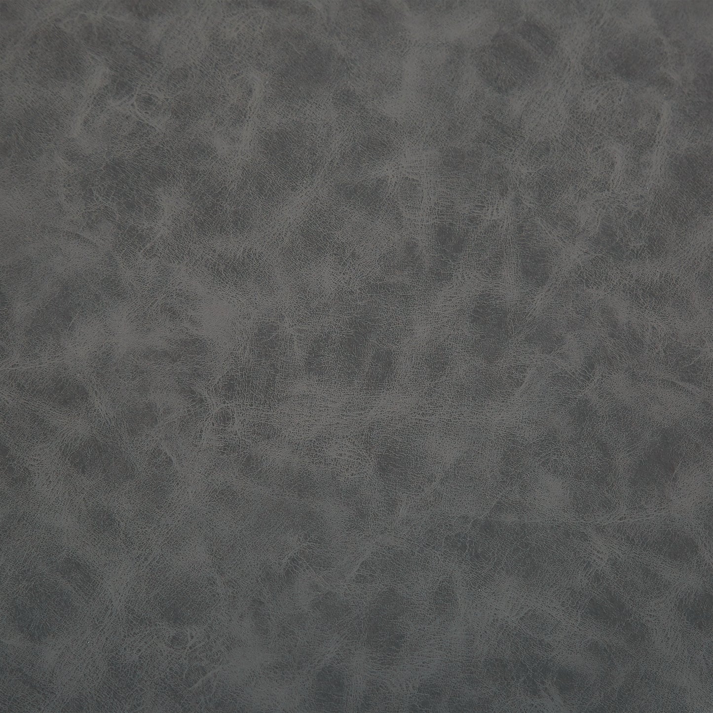 Textured charcoal faux leather material closeup for upholstery projects