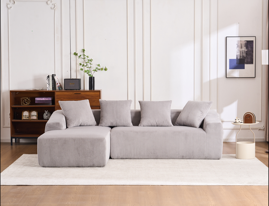 Plush corduroy sectional sofa in a light grey offering comfortable seating for modern living rooms