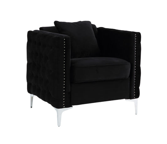 Black velvet accent chair with diamond tufting and silver nailhead trim for a luxurious living room