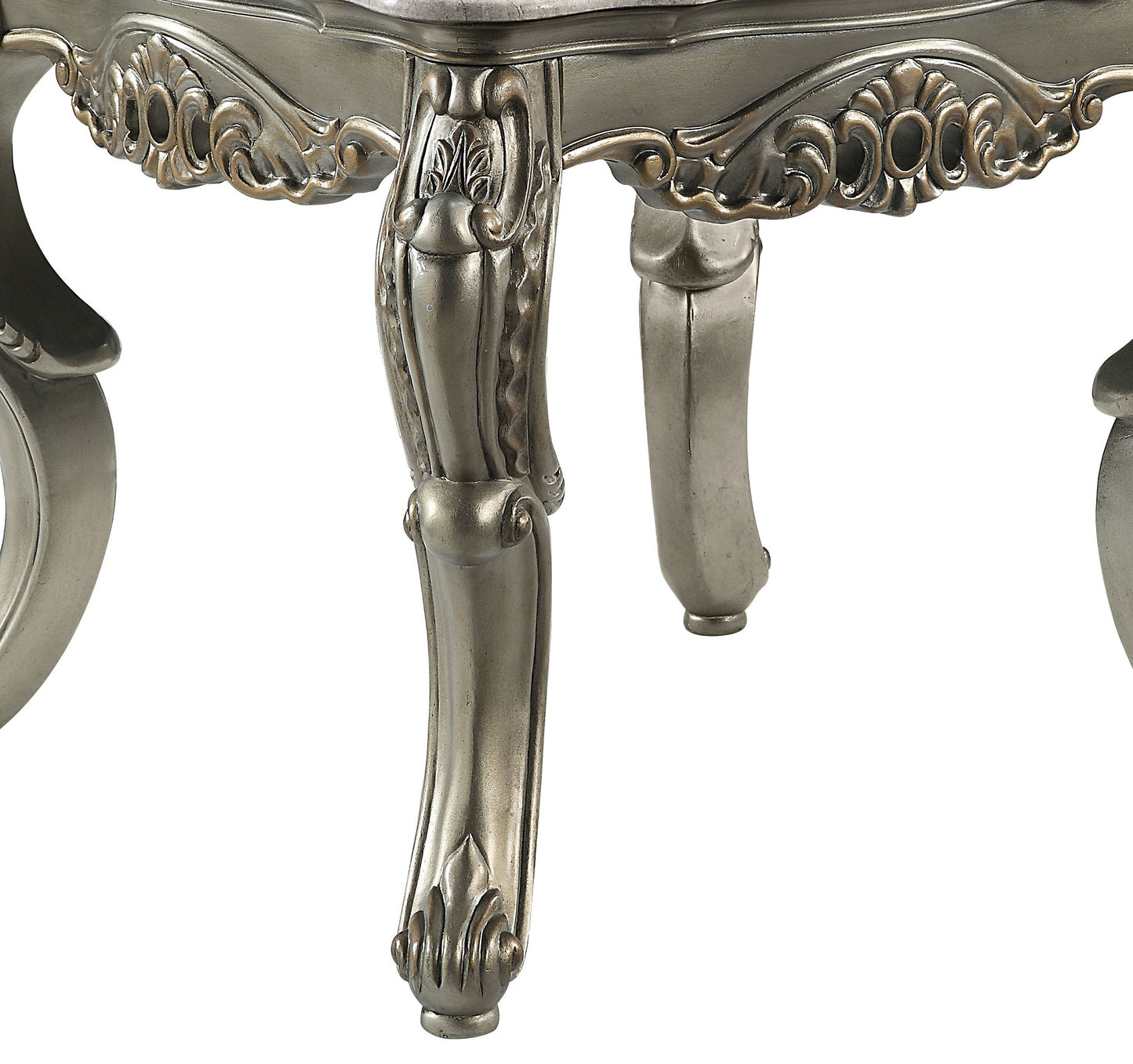 Antique silver carved furniture leg with ornate scrollwork detail