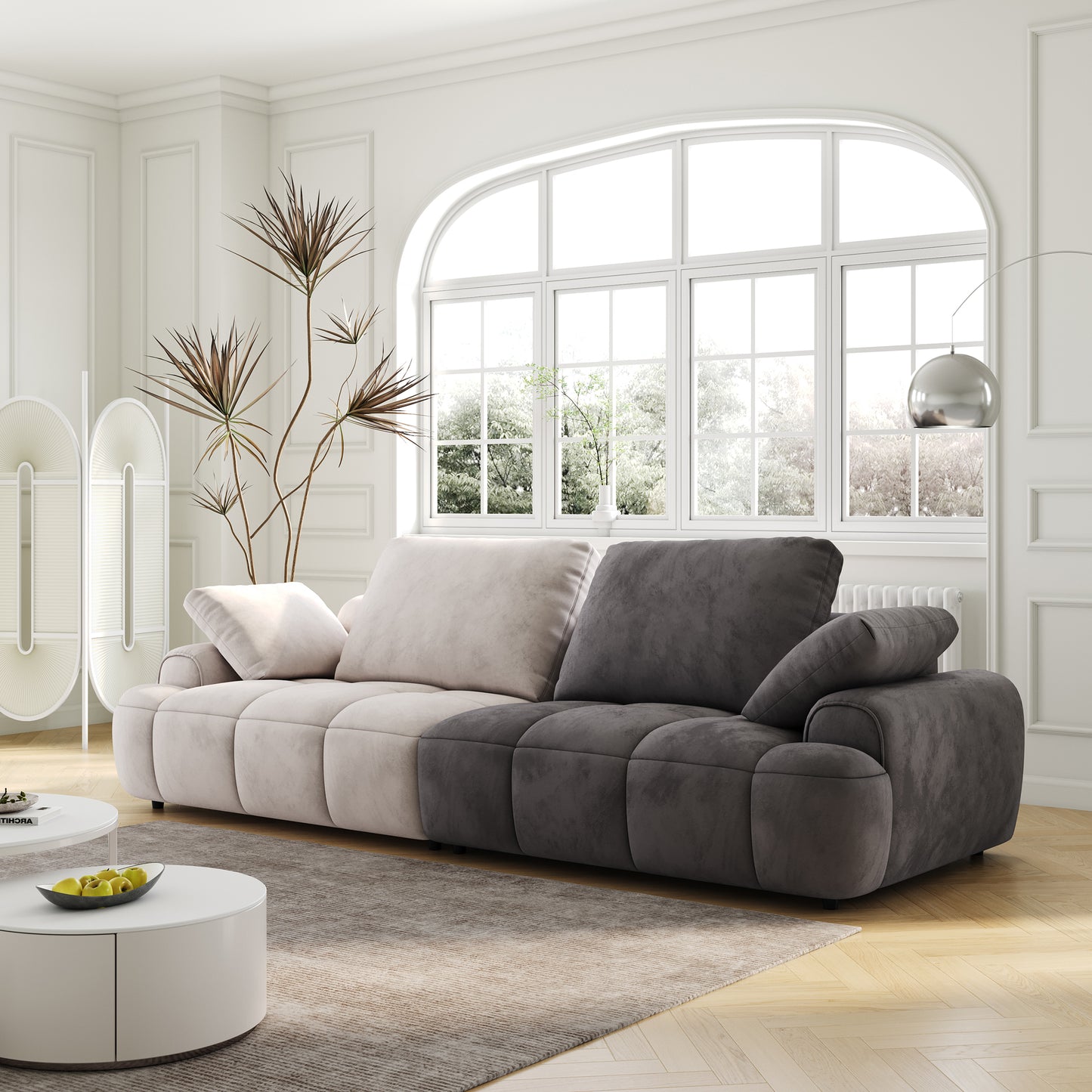 Plush velvet sectional sofa in cream and charcoal featuring deep tufting and ample cushions