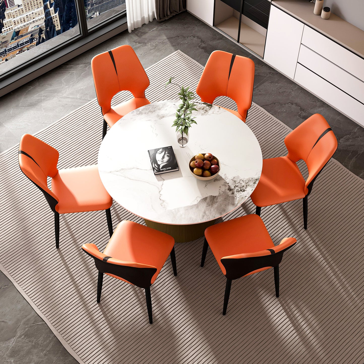 Orange faux leather dining chairs with black accents surrounding a white marbletop table