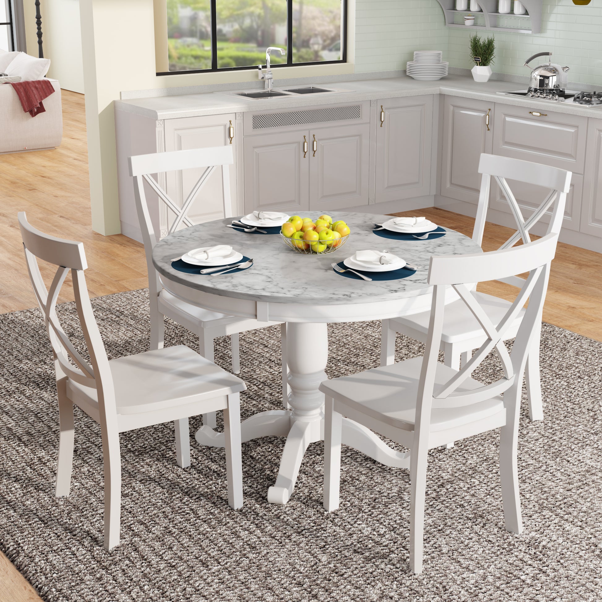 White Xback dining chairs surrounding a round marbletop table with place settings