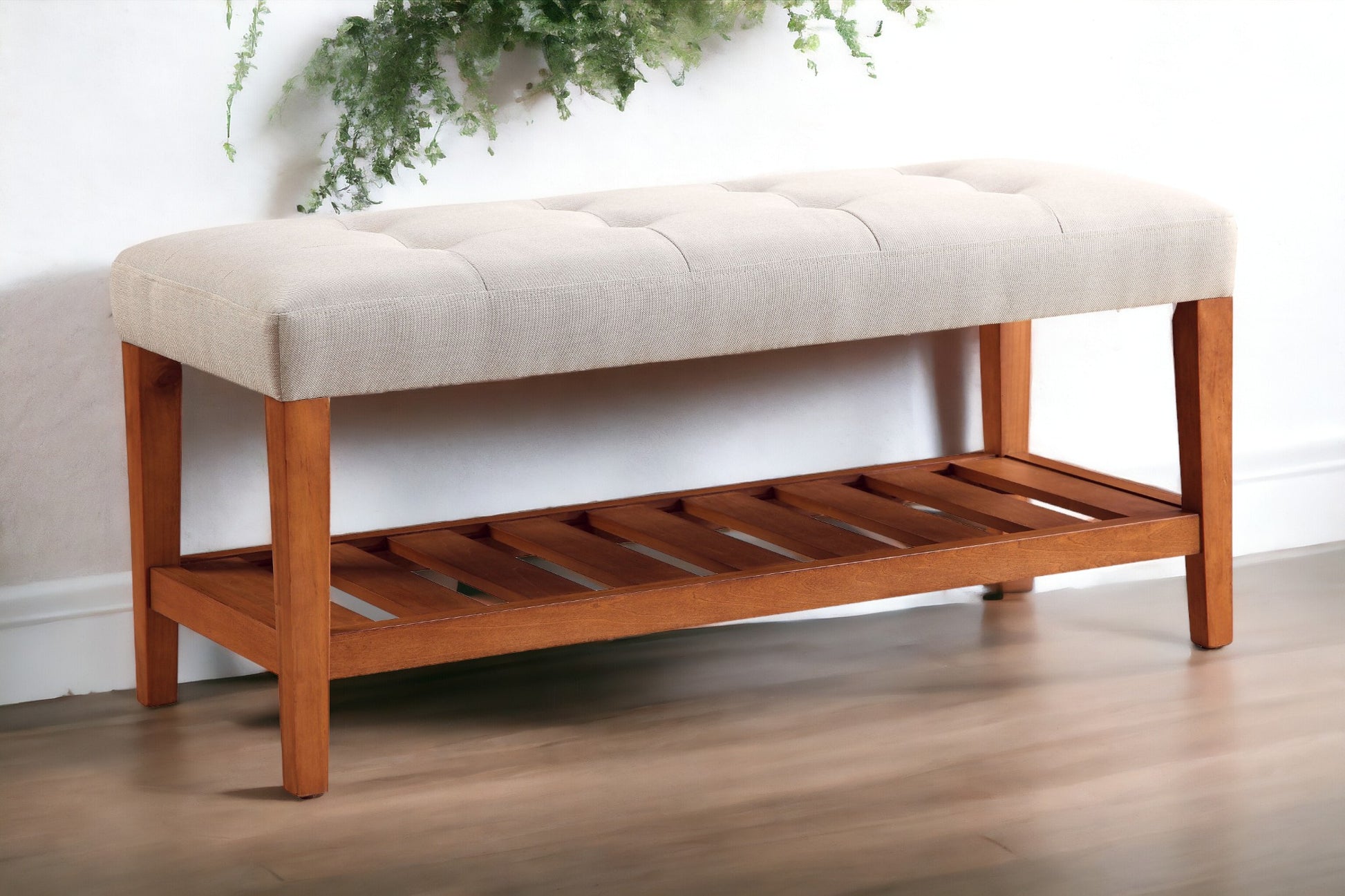 Tufted cream fabric entryway bench with wood shoe rack