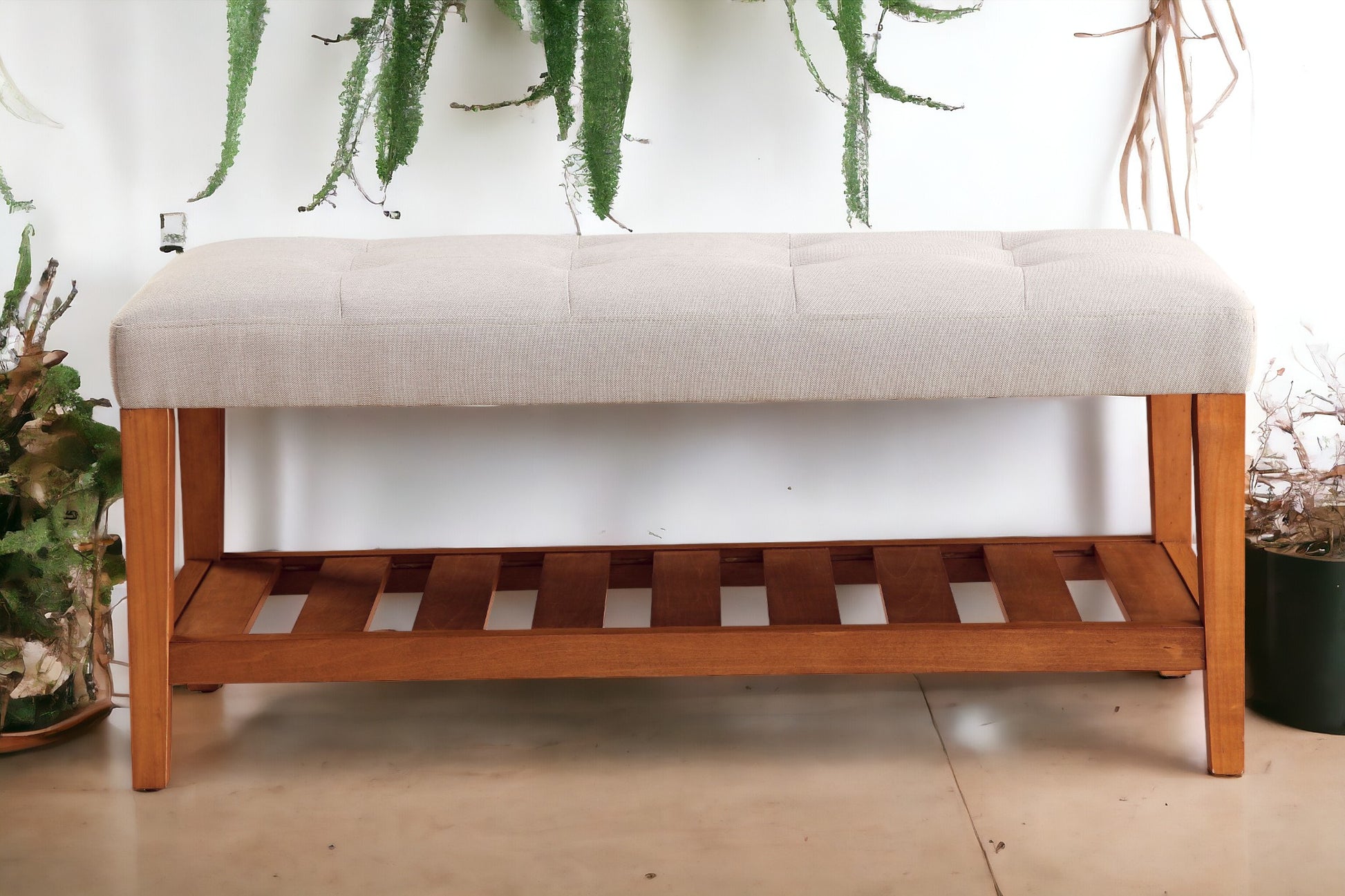 Tufted beige upholstered bench with slatted wooden base