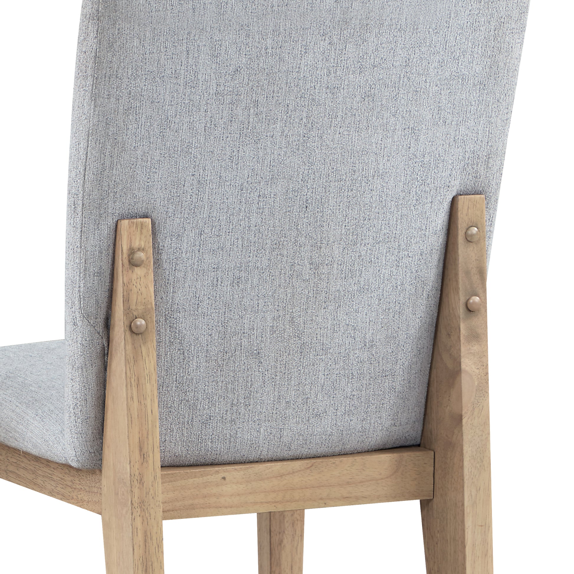 Close up of grey upholstered dining chair back with light wood frame showcasing textured fabric and joinery details