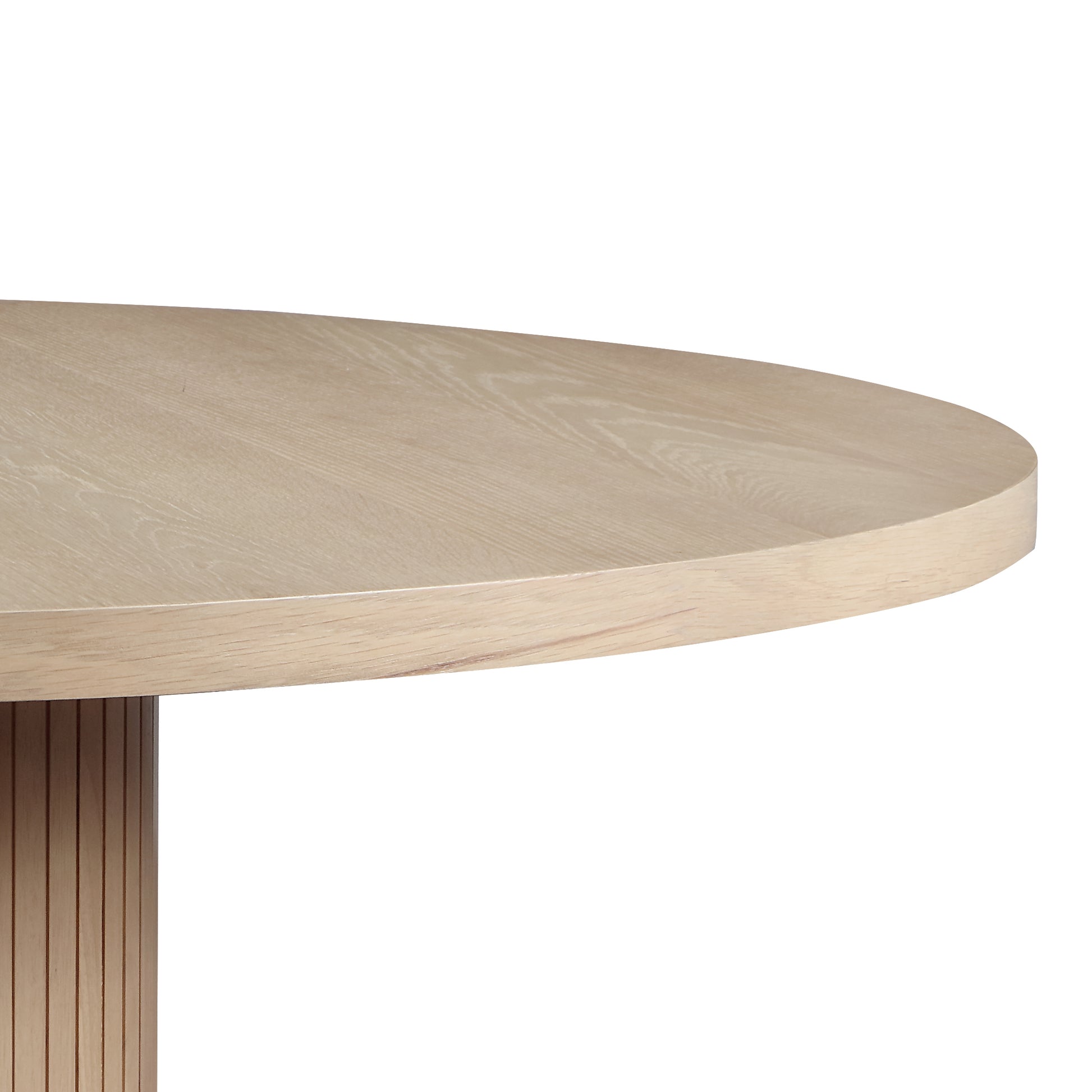 Closeup of a round light oak wood dining table with a slatted pedestal base