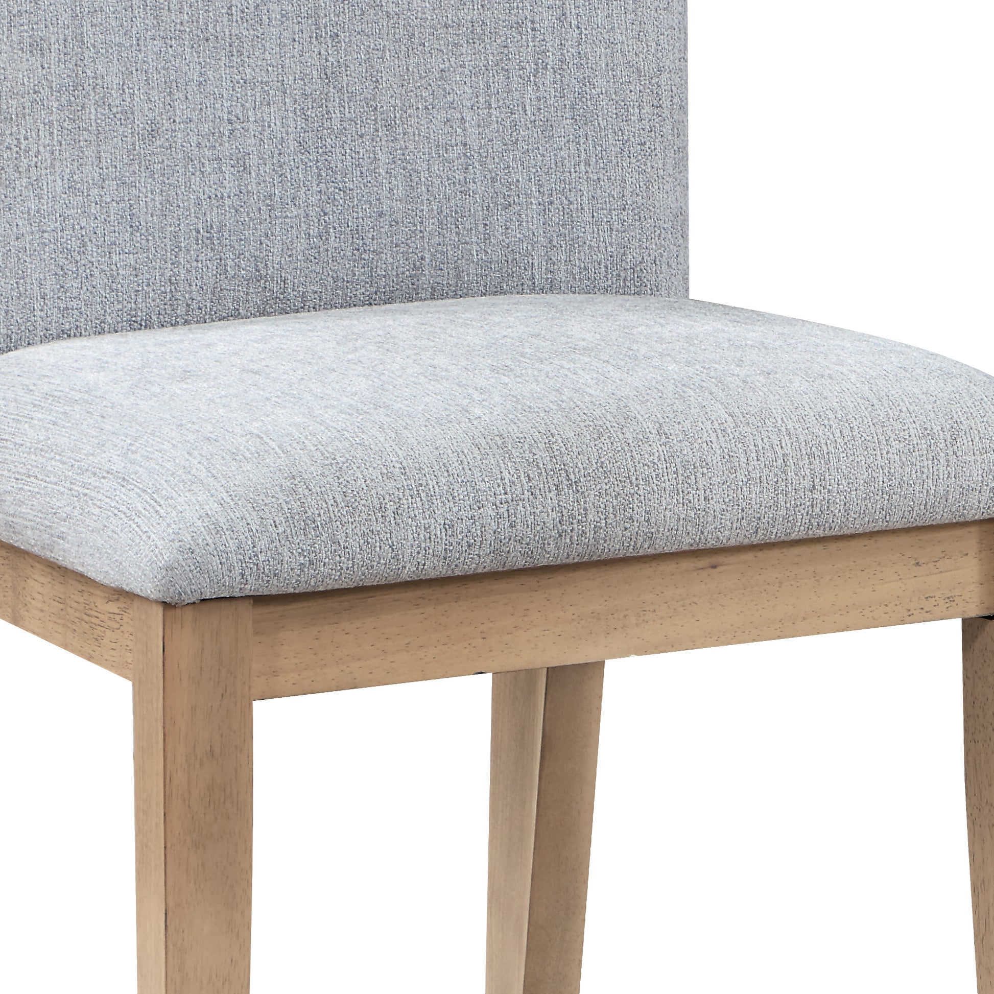 Closeup of a light grey upholstered dining chair with light wood legs