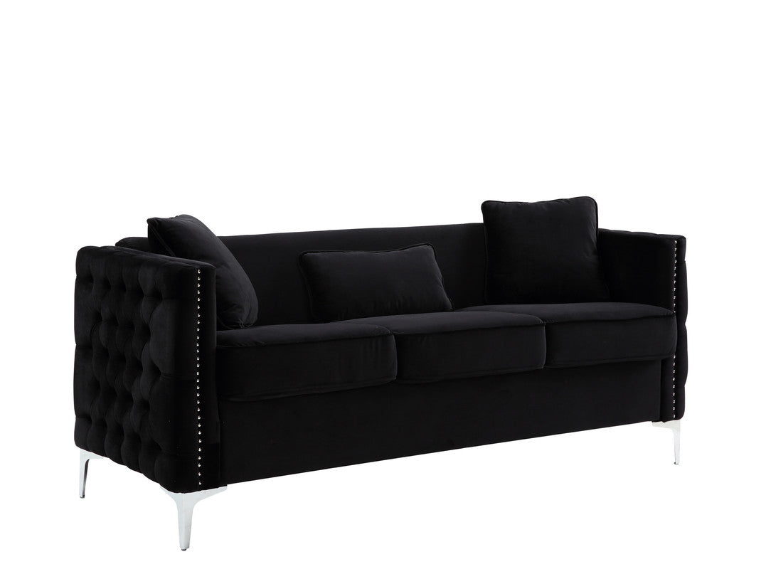 Black velvet sofa with tufted sides and silver stud accents