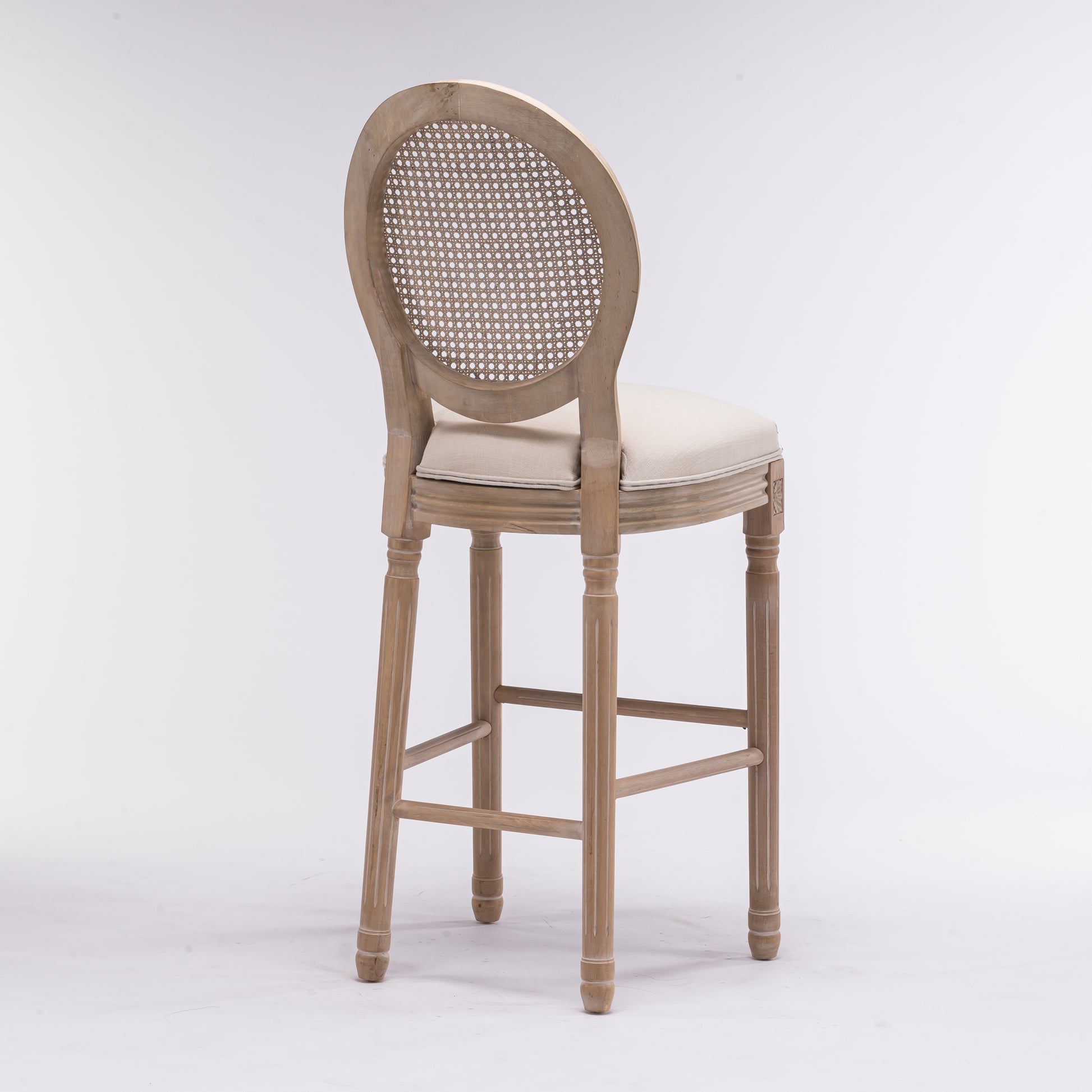 Antique grey wood bar stool with cane back and beige cushion