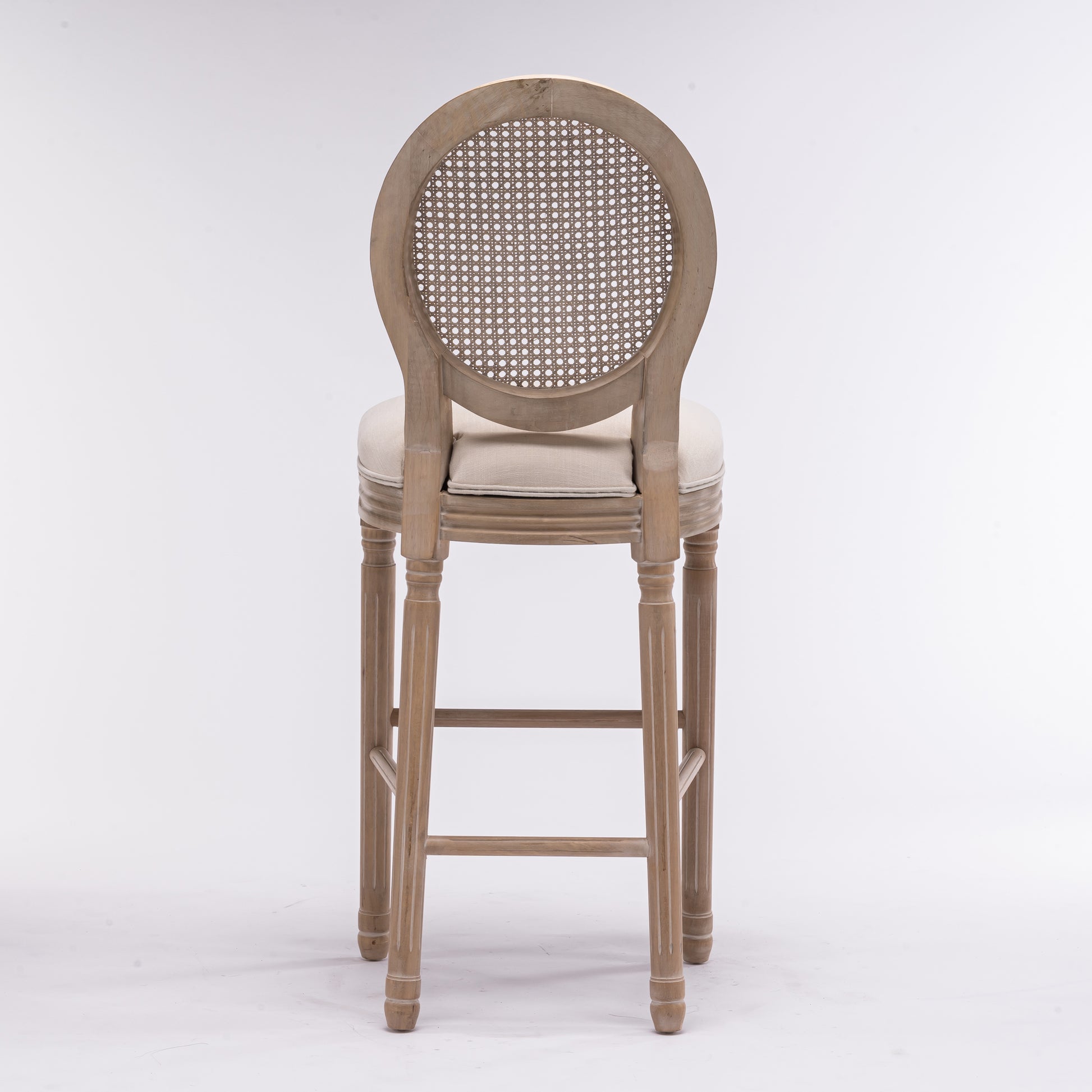 Light wood cane back bar stool with upholstered seat