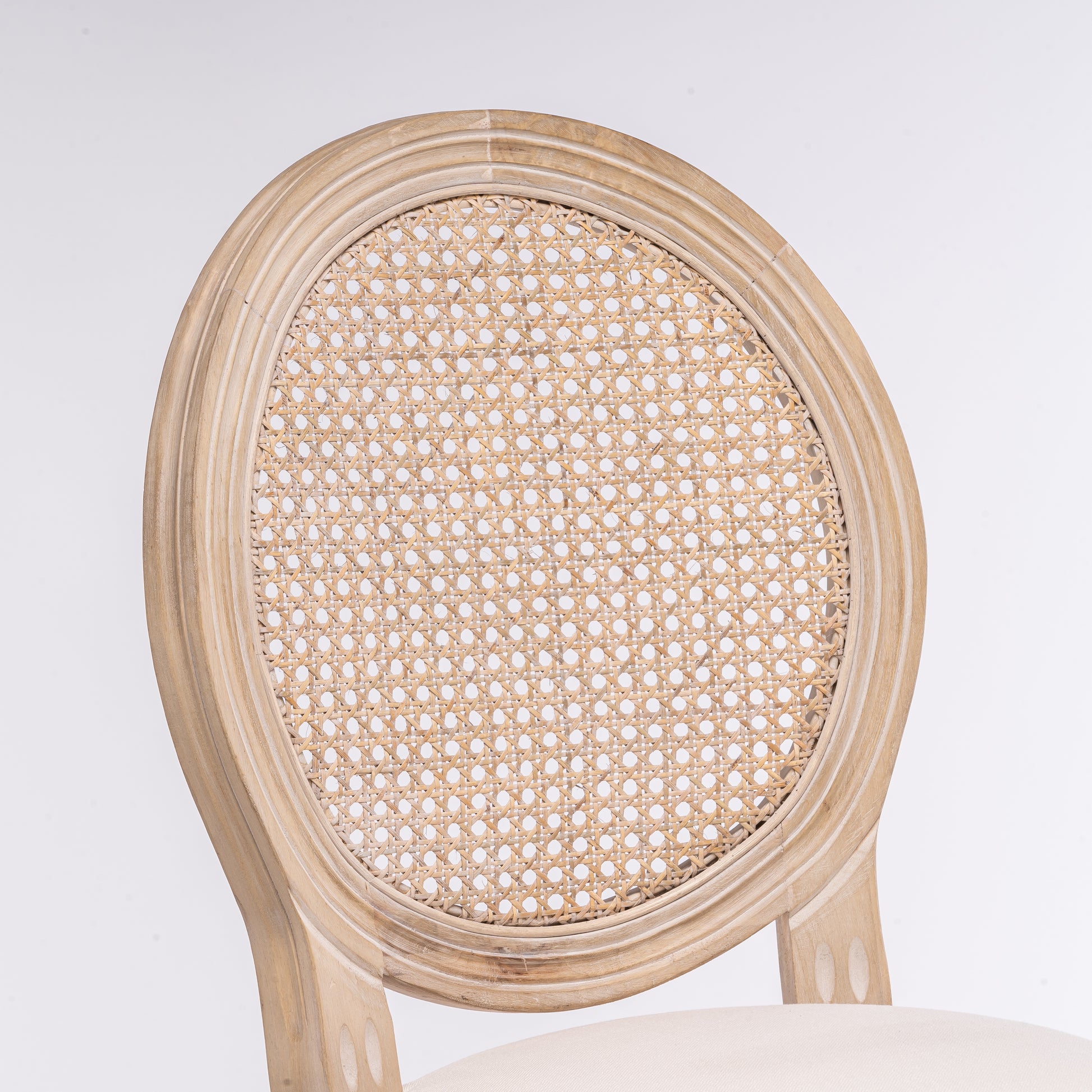 Round back cane chair with distressed wood frame