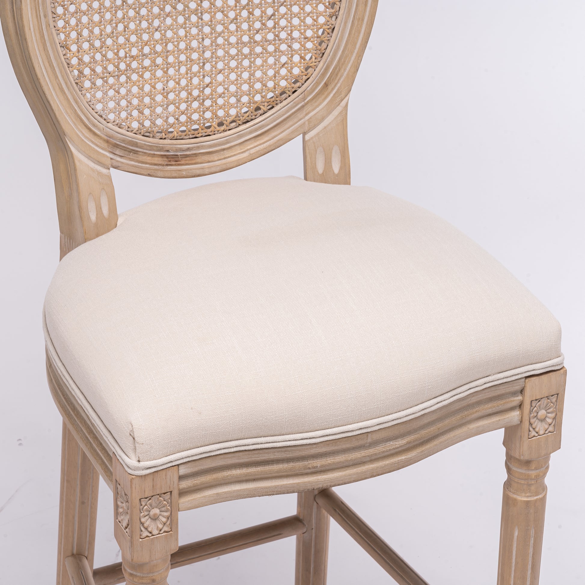 Light oak wood frame bar stool with cane back and upholstered cushion