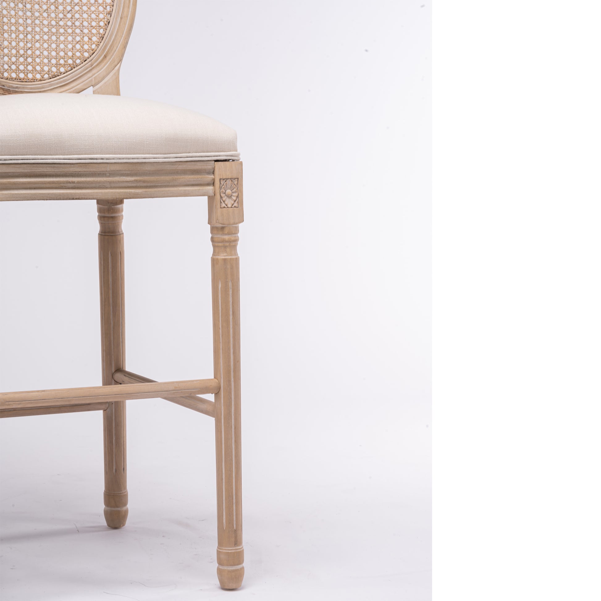 Light oak bar stool with woven cane back and cream upholstered seat