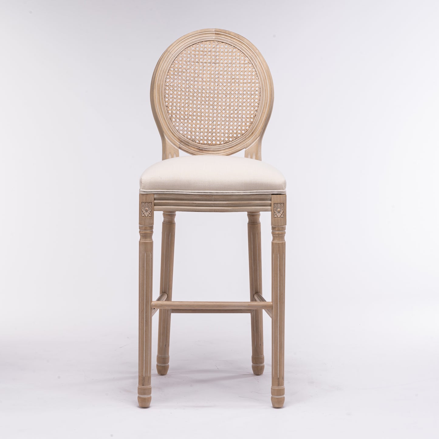Light wood bar stool with woven cane back and cream upholstered seat