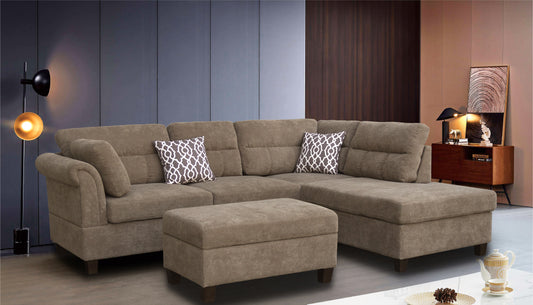 Taupe fabric sectional sofa with two decorative throw pillows and an ottoman