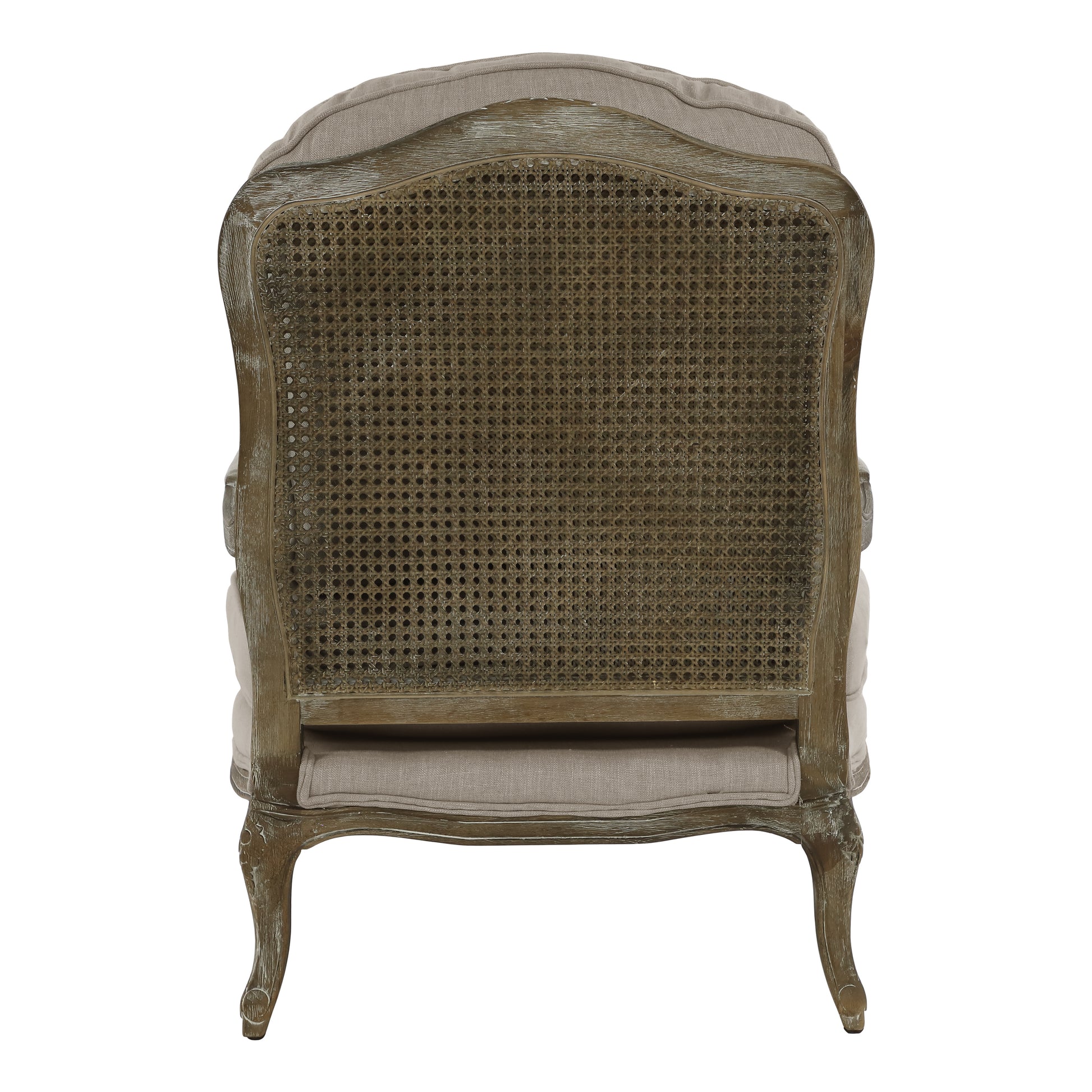 Back view of a French country armchair with woven cane back and neutral linen upholstery