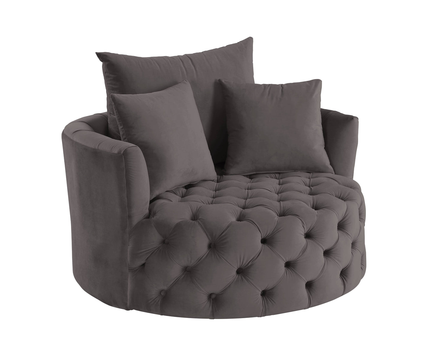 Dark gray velvet accent chair with tufted seat and two throw pillows
