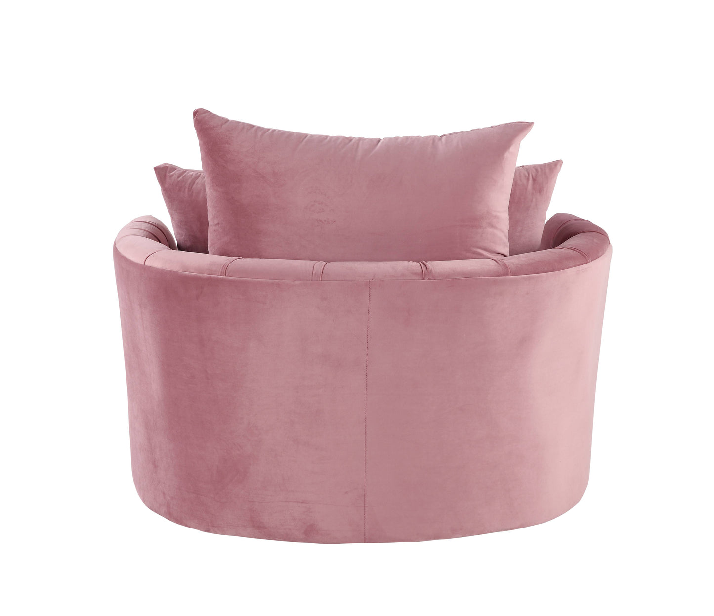 Plush pink velvet accent chair with tufted back and two throw pillows perfect for a cozy reading nook