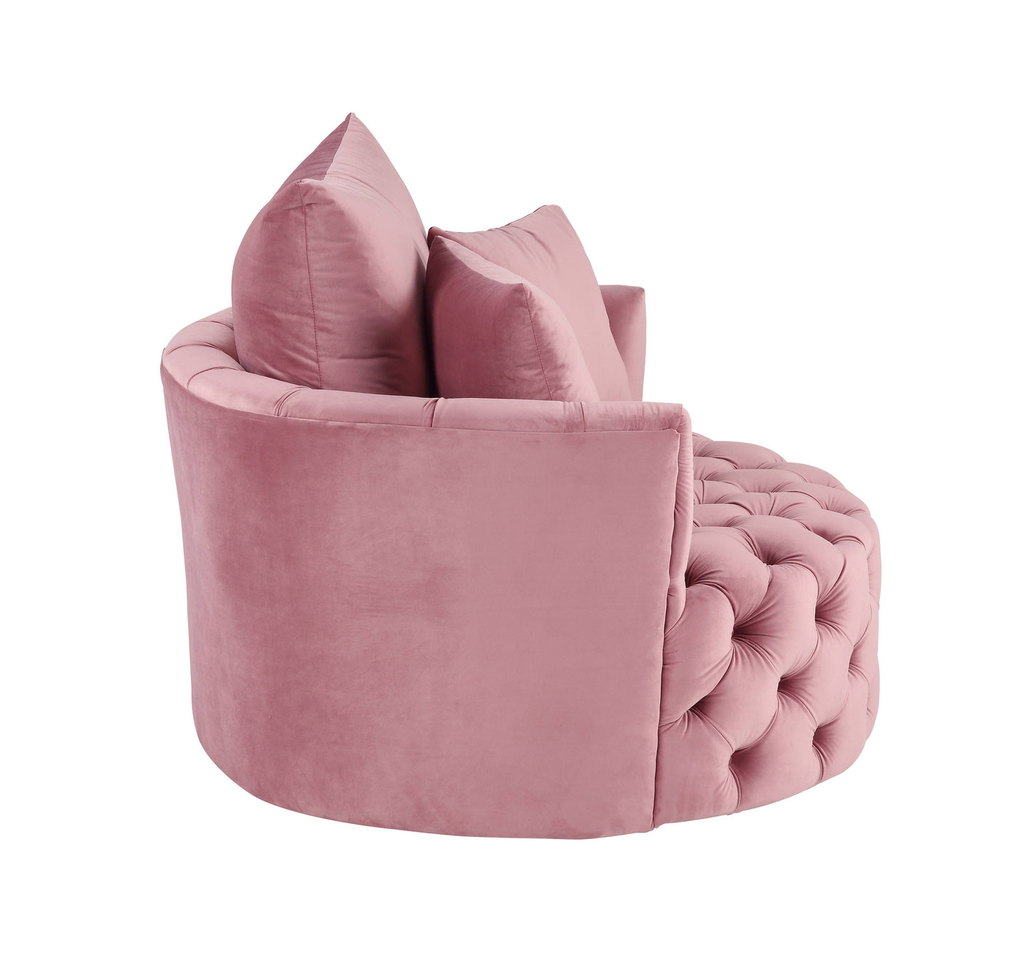 Pink velvet armchair with button tufting and plush accent pillows