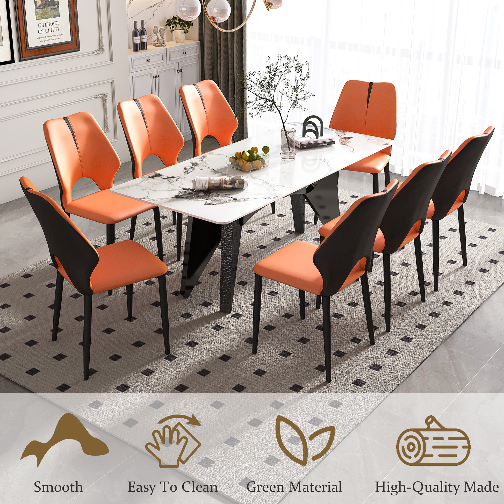 Modern orange and black upholstered dining chairs around a white marble top table