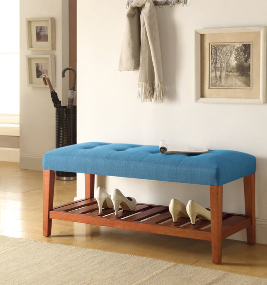 Blue tufted upholstered storage bench with wooden legs and slatted shoe rack