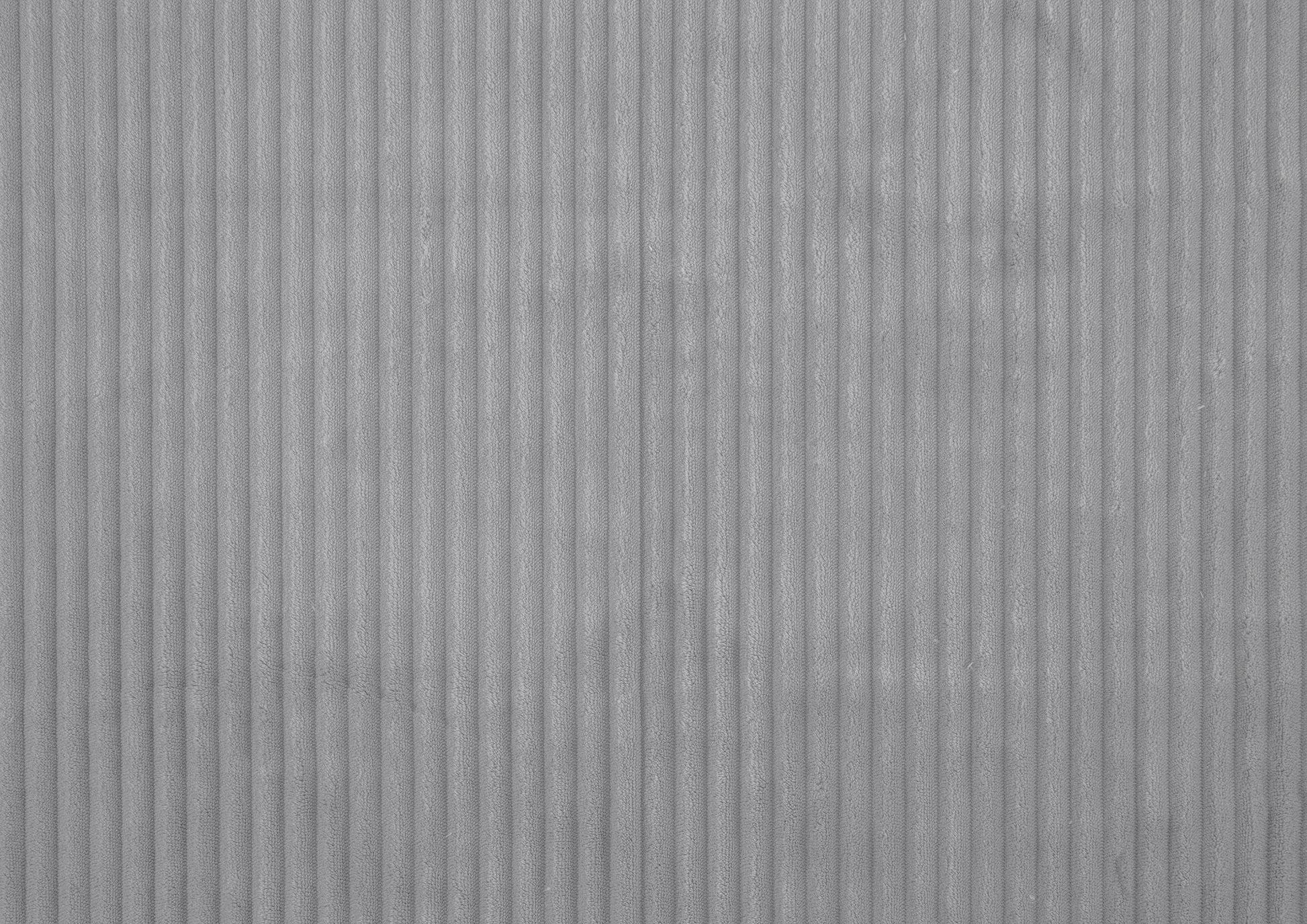 Soft grey corduroy fabric with raised vertical wales perfect for upholstery projects