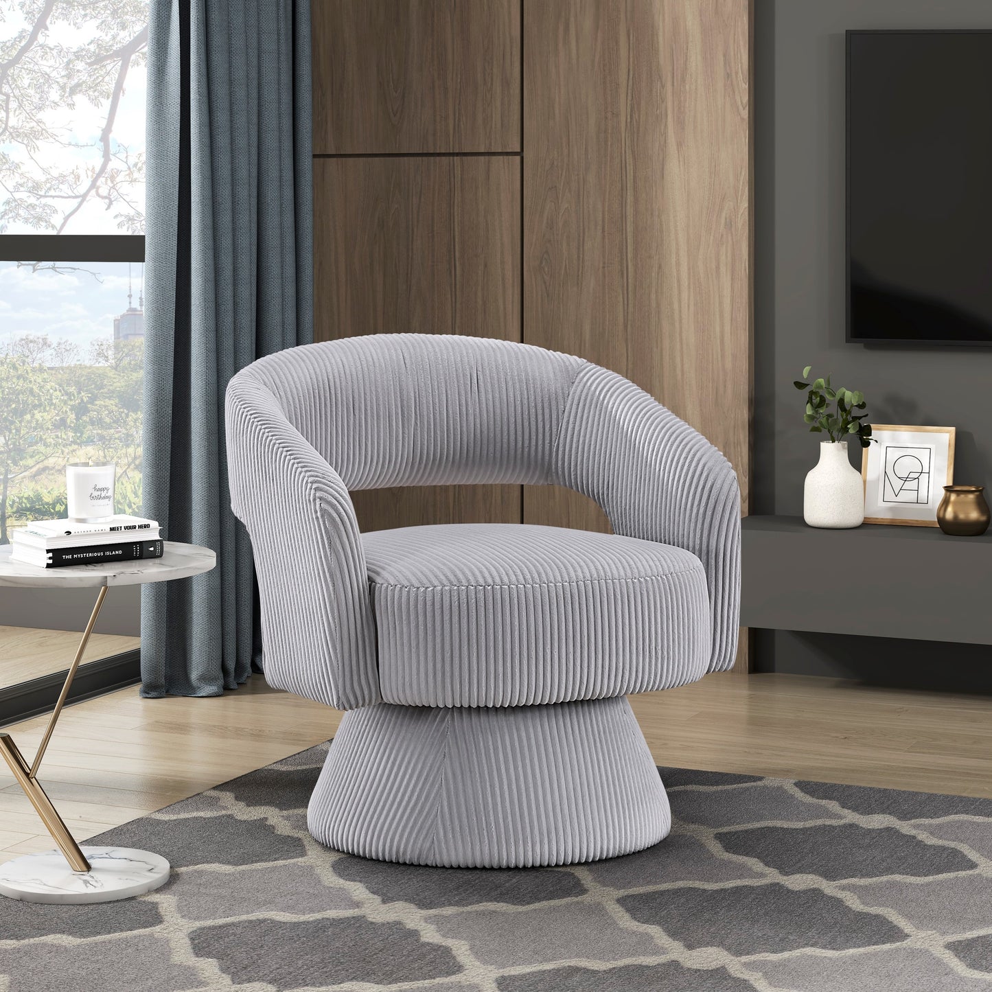 Light grey corduroy swivel accent chair with rounded arms and a tufted seat