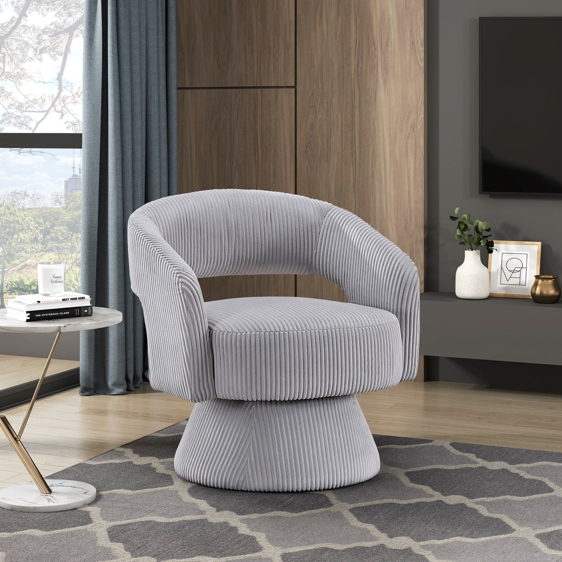 Light grey corduroy swivel accent chair with rounded arms and a tufted seat