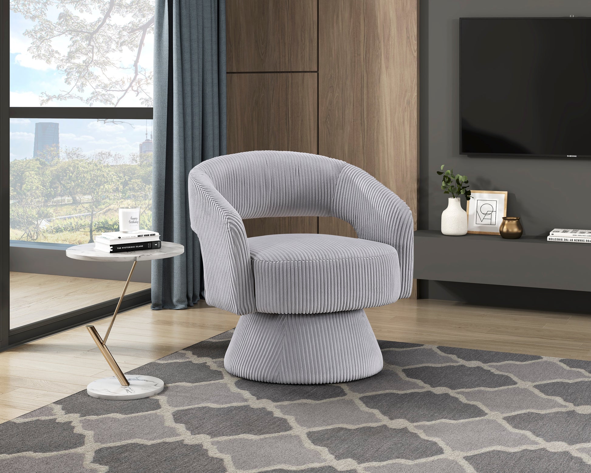 Textured grey swivel accent chair with plush corduroy upholstery and a rounded silhouette