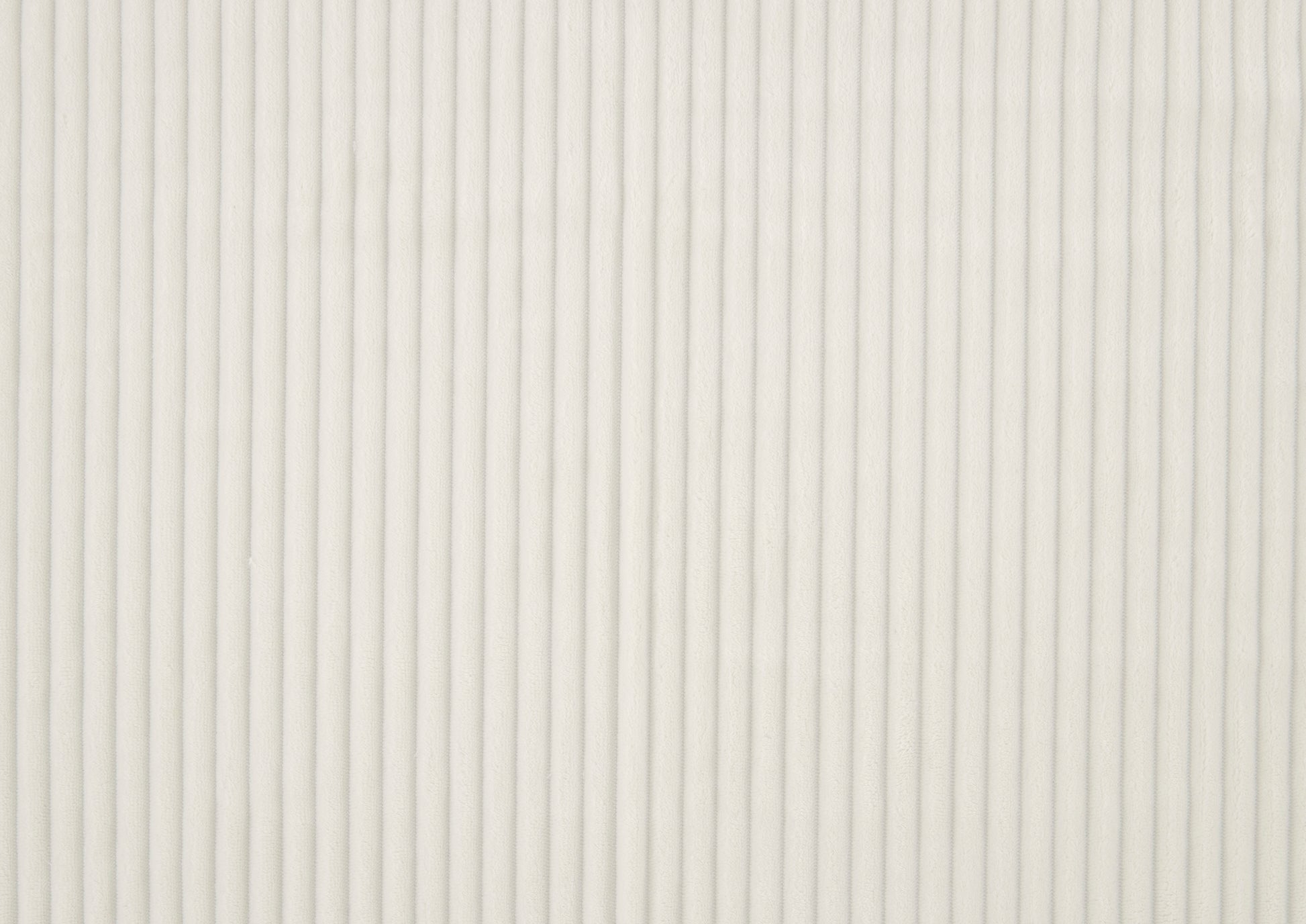 Cream corduroy fabric with narrow vertical ridges perfect for upholstery
