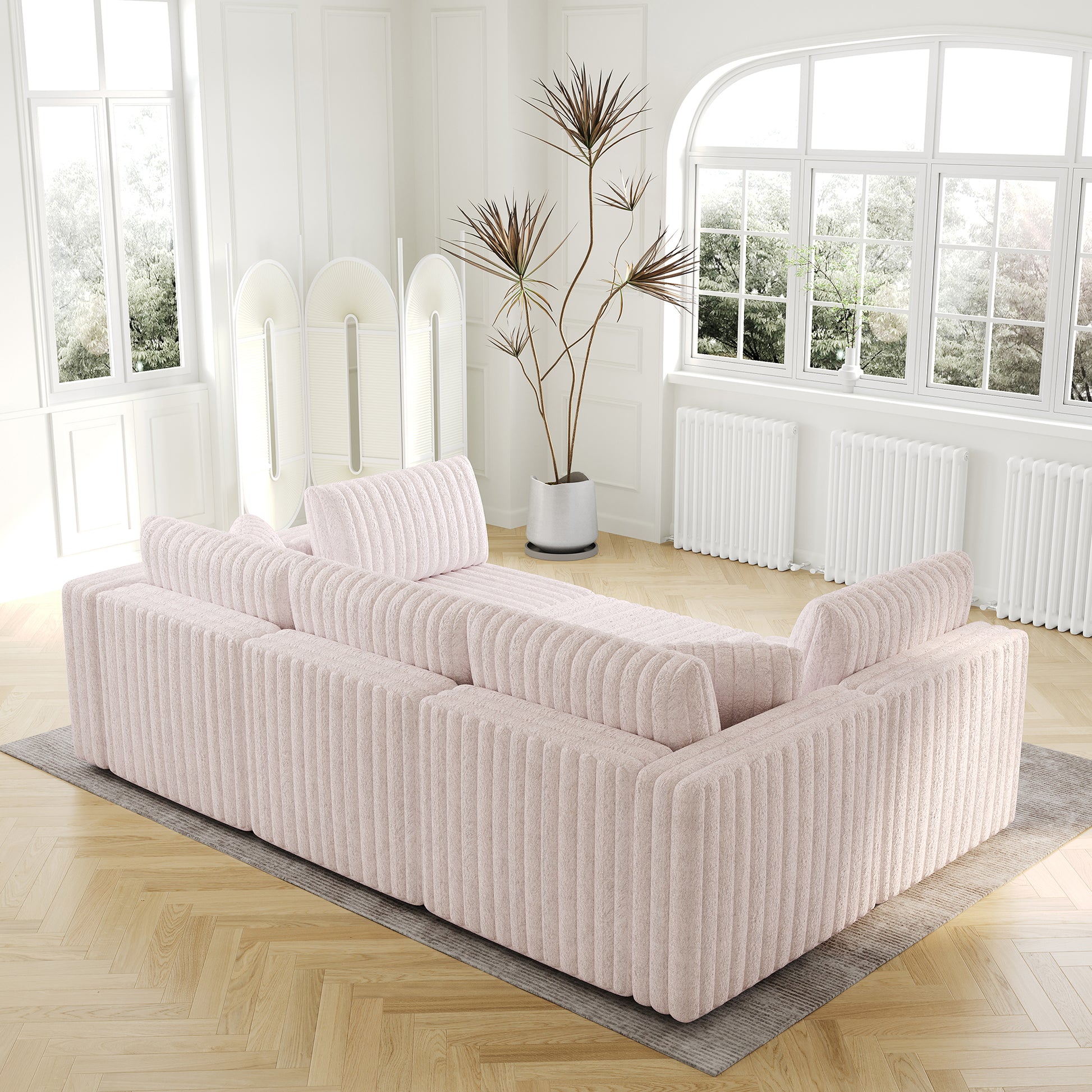 Soft pink corduroy sectional sofa with plush cushions modern design for living room comfort